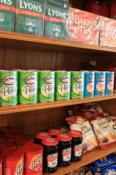 Shelf of Lyons and Barry’s Irish tea and imported goods