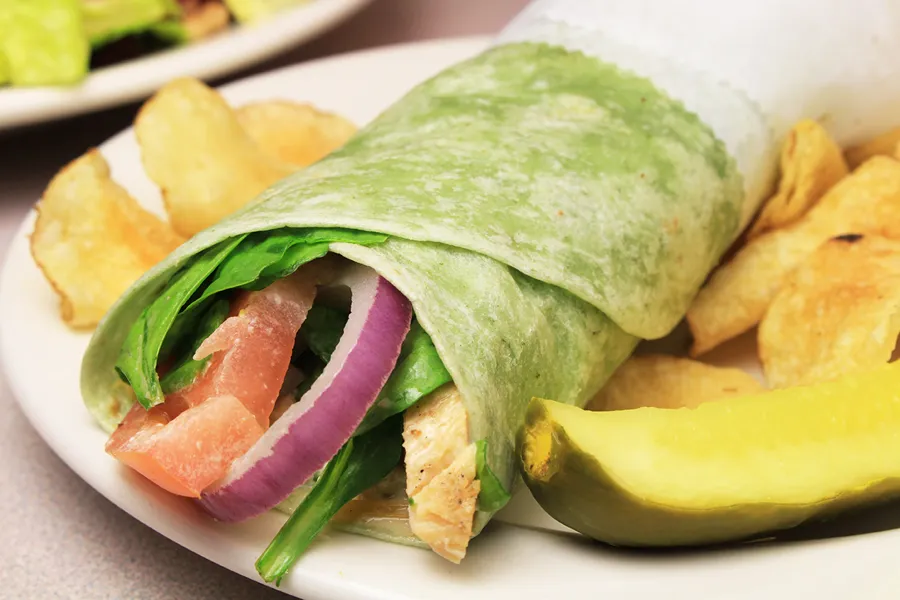 Spinach wrap with chicken and tomato